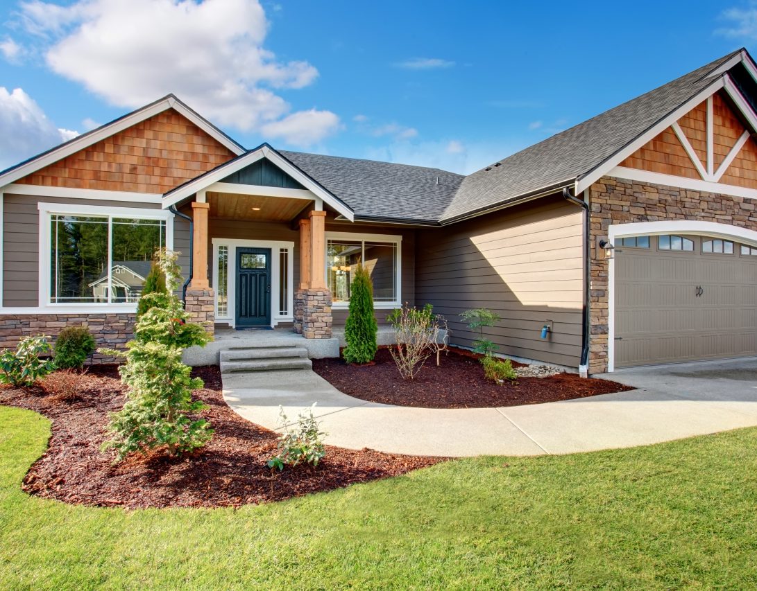 house with well-kept lawn illustrating improve curb appeal